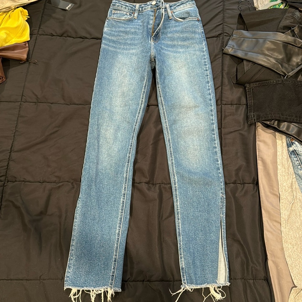 Blue jeans with ankle slit